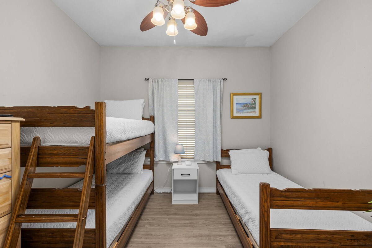 Second bedroom with three twin beds