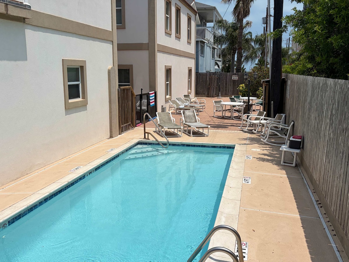 Shared swimming pool steps from the condo
